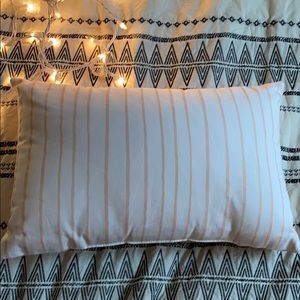 White and light pink pillow